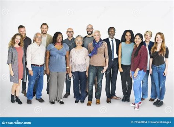 a group of people standing next to each other in front of a building