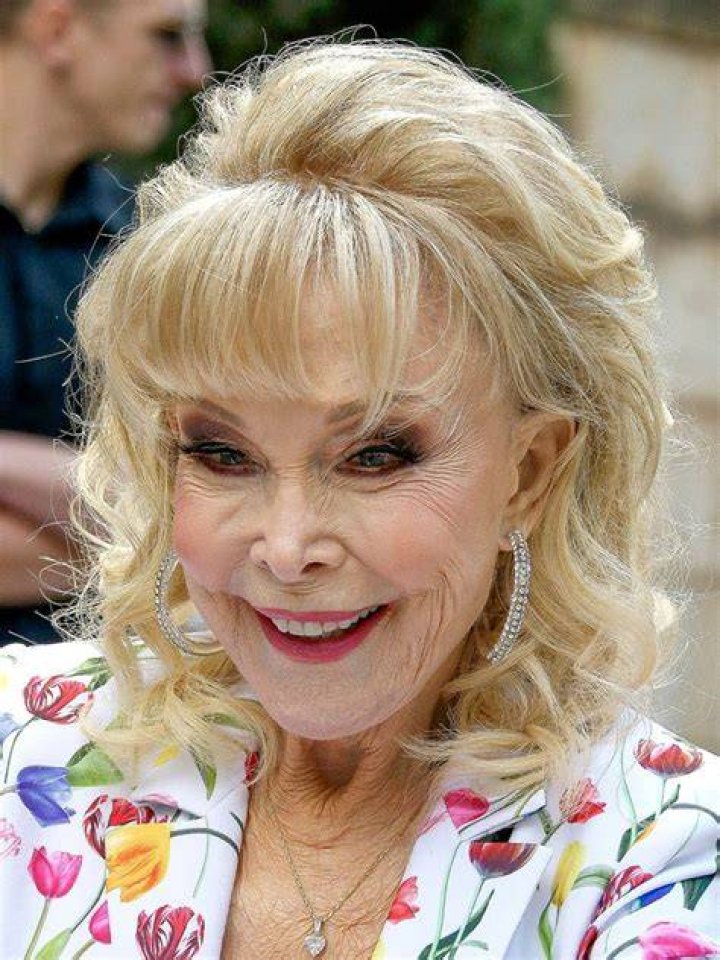 Actress Barbara Eden, 2nd right, attends the funeral for her son