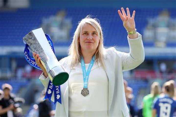 Emma Hayes (Chelsea Manager) salutes the fans with her son during the
