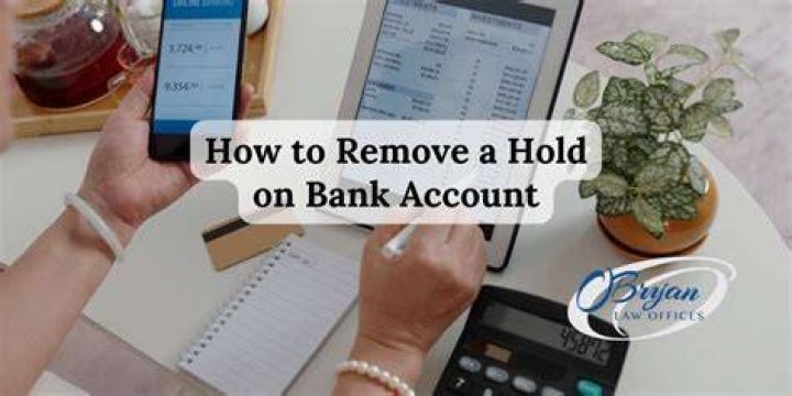 How do I remove a hold from my bank account?