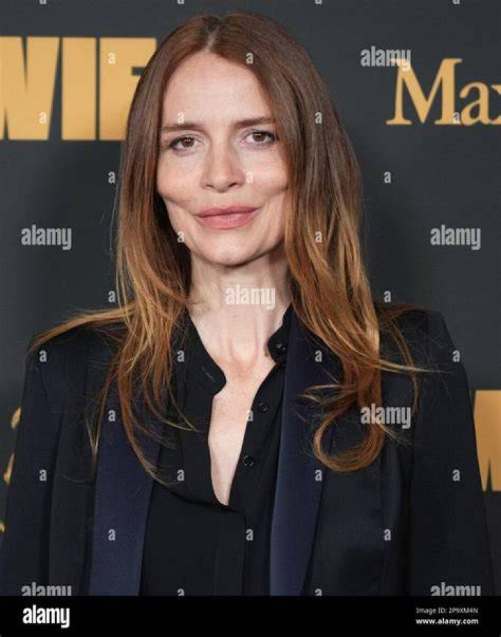 Saffron Burrows engages in a very public display of affection with new