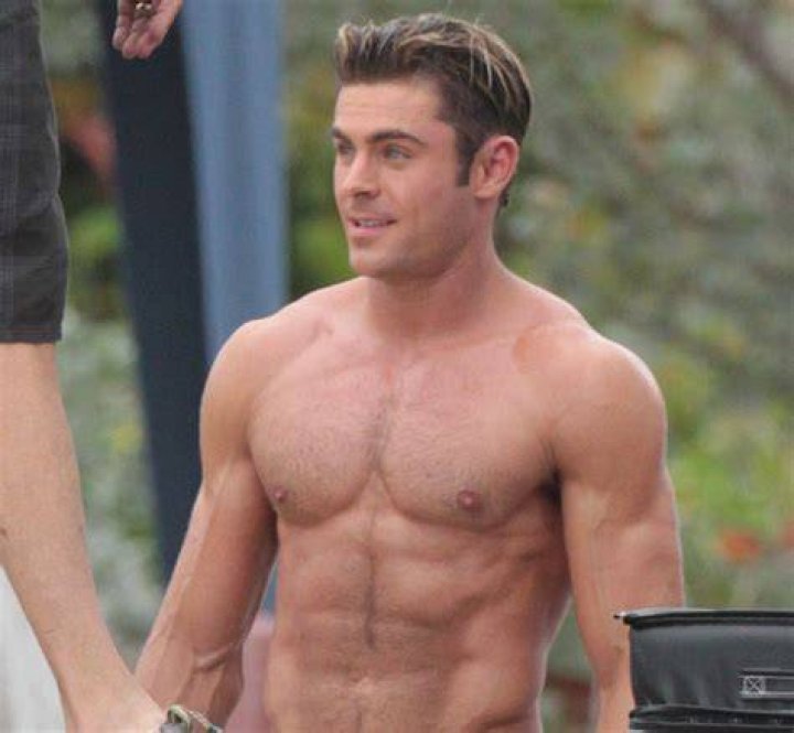 Shirtless Zac Efron holds girlfriend Sami Miro's hand as they cruise