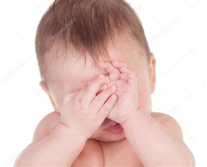 Why do babies cover their face when nursing?