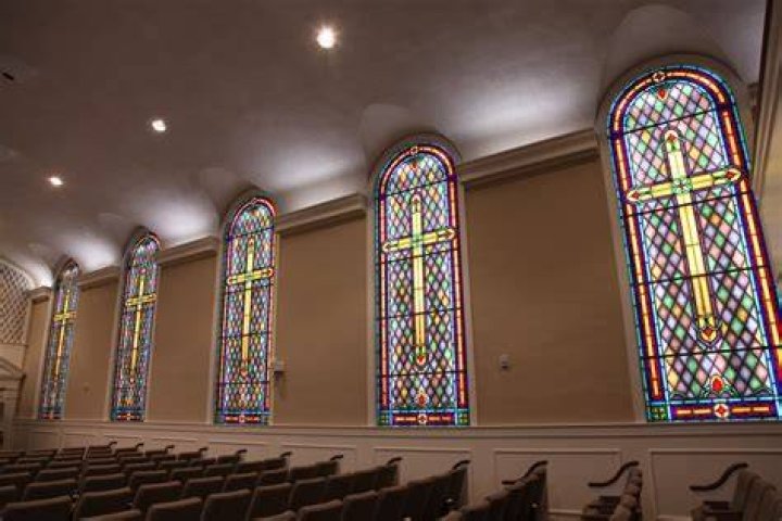 Why do churches have colored windows?